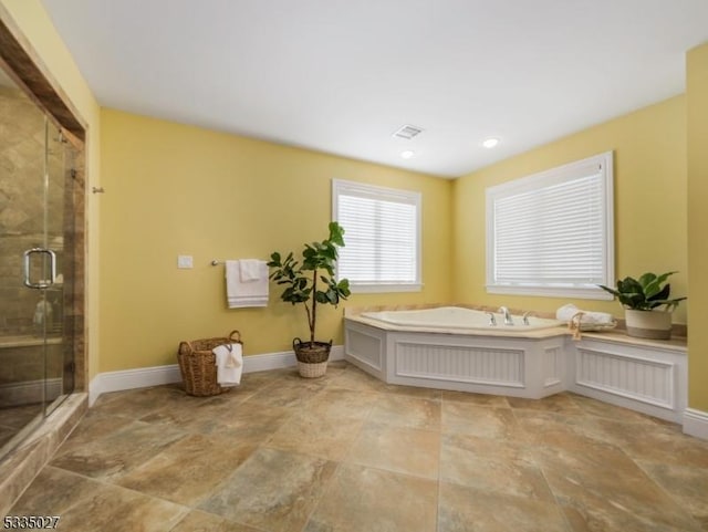 bathroom featuring a shower with shower door