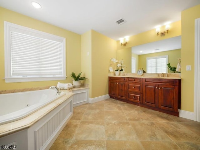 bathroom featuring vanity and a bathtub