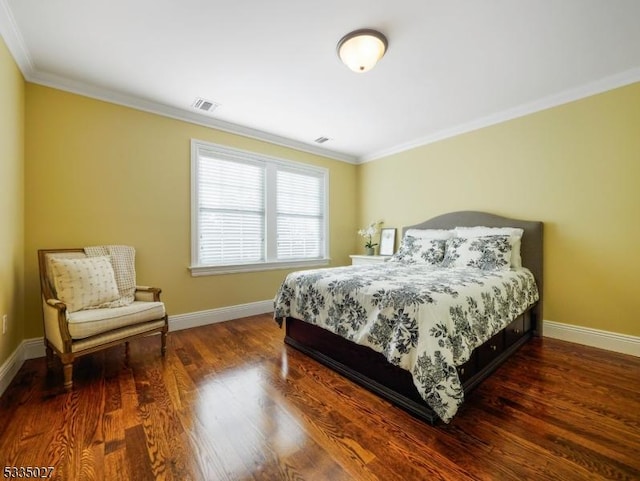 bedroom with dark wood-type flooring and ornamental molding