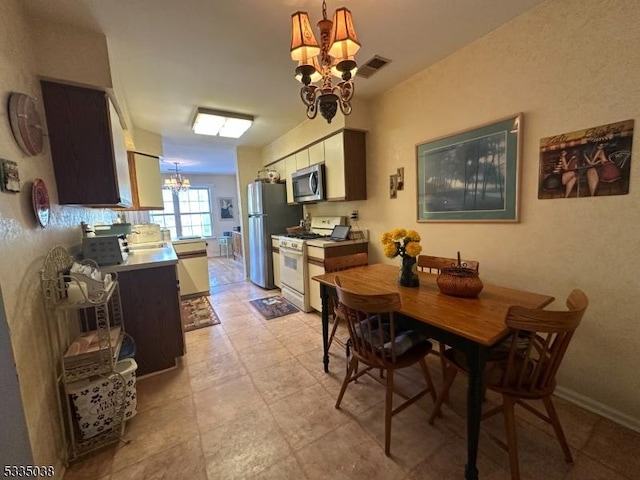 dining space featuring a chandelier