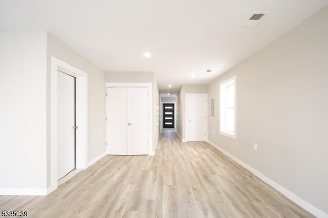 unfurnished living room with light wood-type flooring