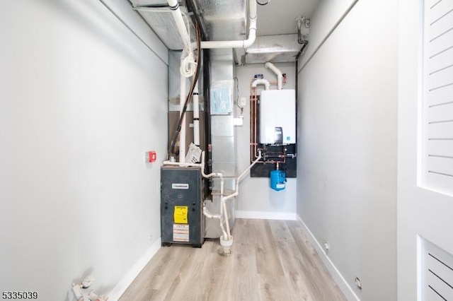 utility room featuring water heater