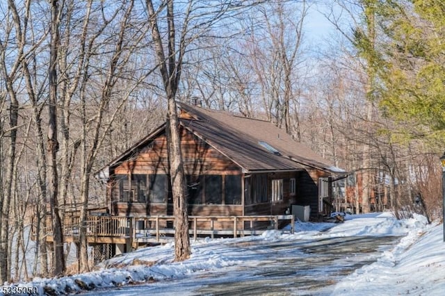 view of front of home featuring a sunroom