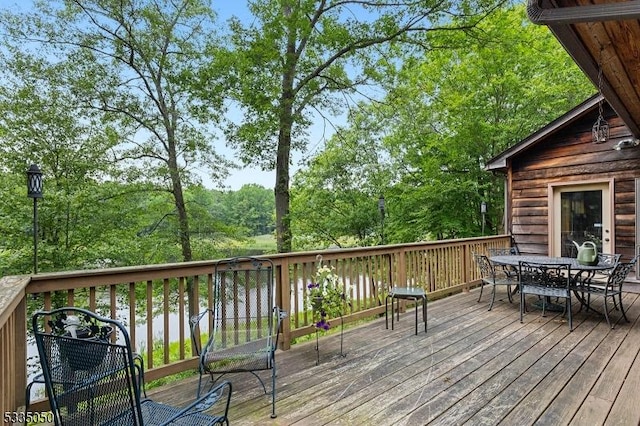 deck featuring outdoor dining area