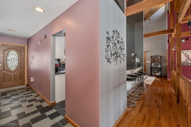 entryway with baseboards and dark wood finished floors