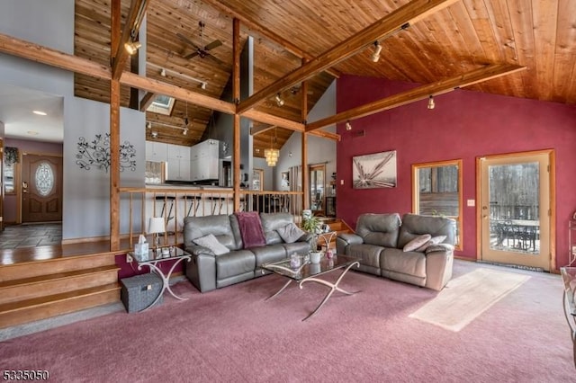 living area featuring carpet floors, rail lighting, wood ceiling, and high vaulted ceiling