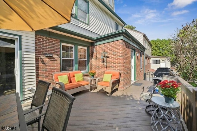 wooden terrace featuring outdoor lounge area