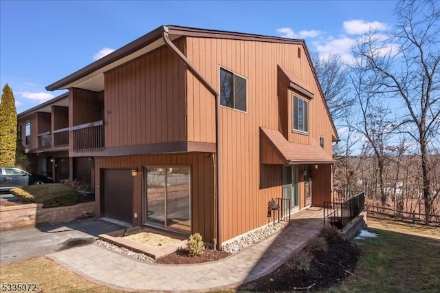 exterior space featuring driveway and a garage