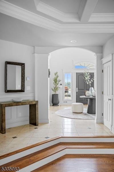 hall with hardwood / wood-style flooring and ornamental molding