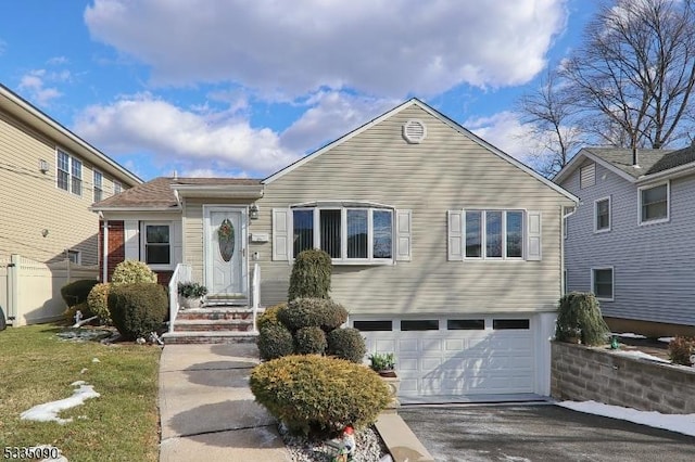 view of front of property with a garage