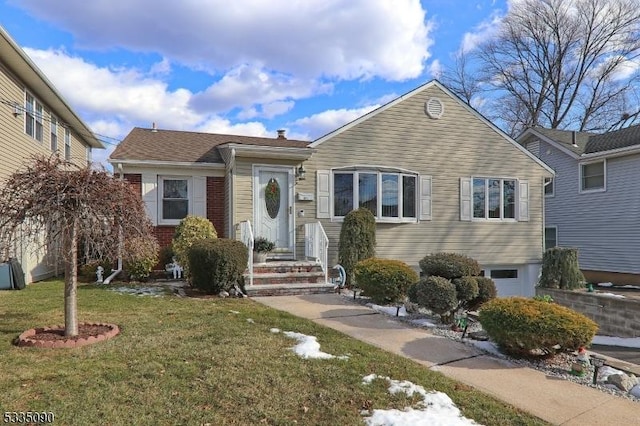 bungalow with a front yard