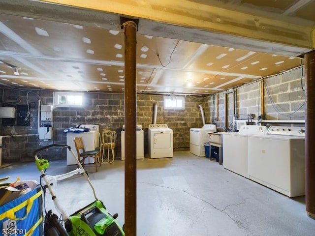 basement with a wealth of natural light and washer and clothes dryer