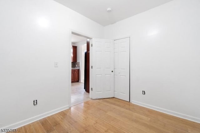 unfurnished room featuring light hardwood / wood-style floors