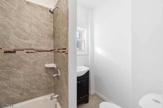 full bathroom with vanity, toilet, tiled shower / bath combo, and tile patterned flooring