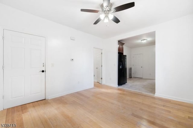 unfurnished room featuring light hardwood / wood-style floors and ceiling fan