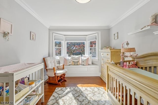 bedroom with crown molding and dark hardwood / wood-style floors