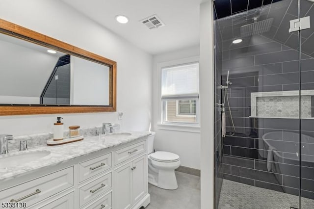 bathroom with vanity, an enclosed shower, and toilet