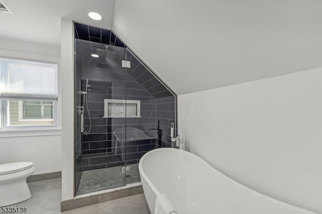 bathroom featuring toilet, tile patterned flooring, vaulted ceiling, and shower with separate bathtub