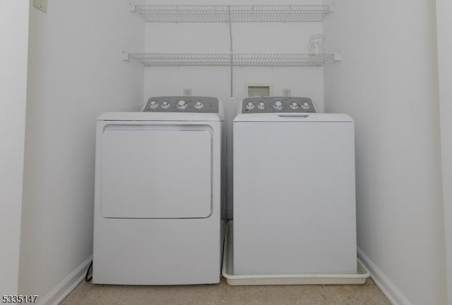 laundry room with separate washer and dryer