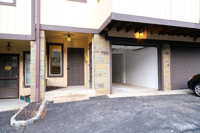 doorway to property featuring a garage