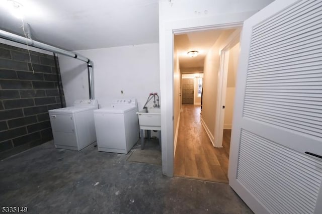 clothes washing area featuring washer and clothes dryer