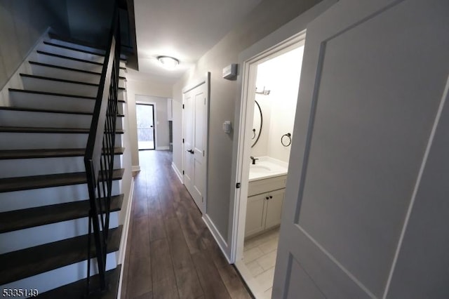 hallway with dark wood-type flooring