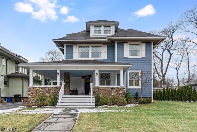 view of front of house featuring a porch and a front yard