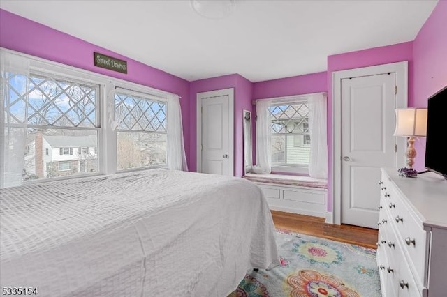 bedroom with light wood-type flooring