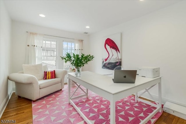 office featuring baseboards, wood finished floors, and recessed lighting