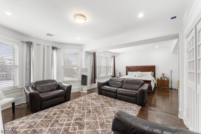 bedroom with dark wood-type flooring