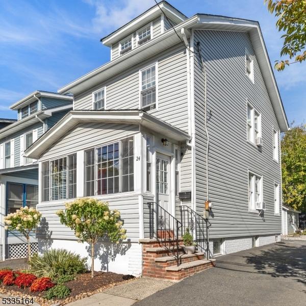 view of front of property with a sunroom