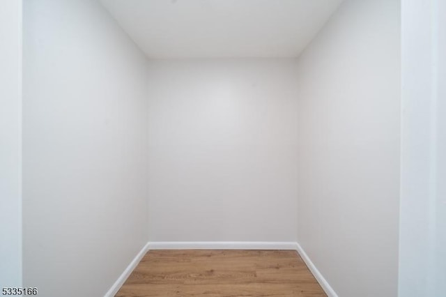 empty room with wood-type flooring