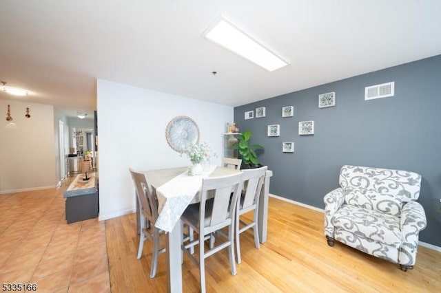 dining room with light wood-type flooring