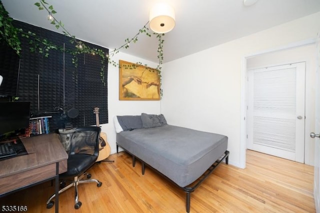 bedroom with hardwood / wood-style flooring