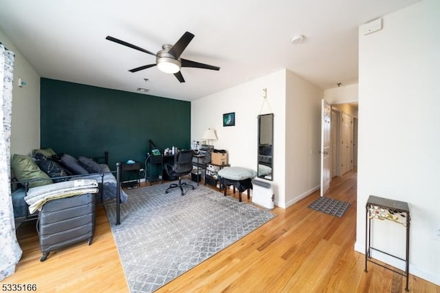 office area with hardwood / wood-style flooring and ceiling fan