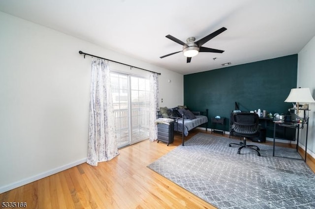 office space with hardwood / wood-style flooring and ceiling fan