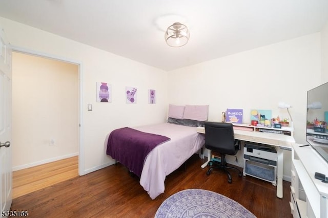 bedroom featuring dark wood-type flooring