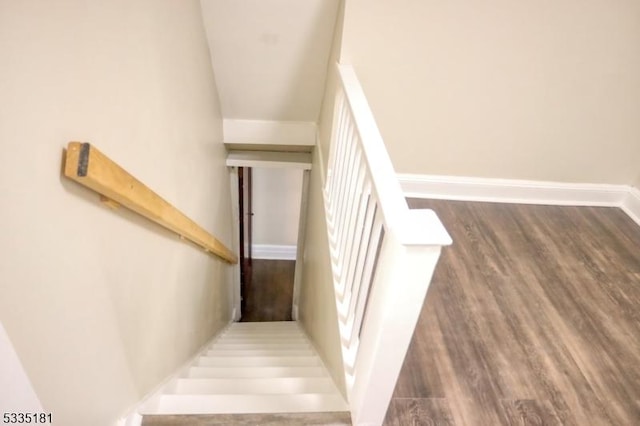 stairway featuring hardwood / wood-style floors