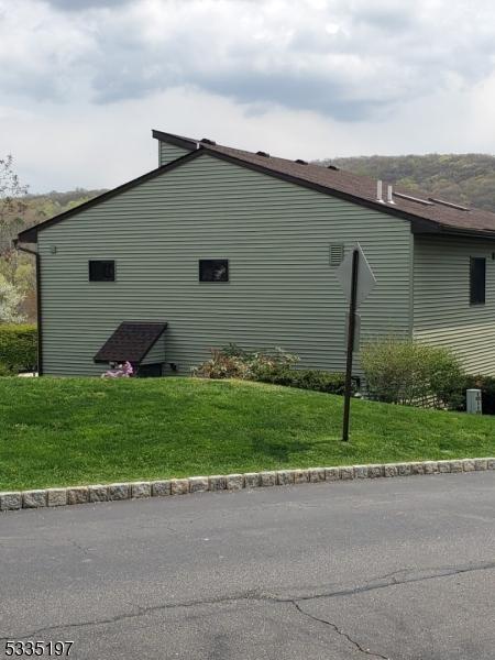 view of home's exterior featuring a lawn