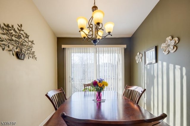 dining space featuring a chandelier