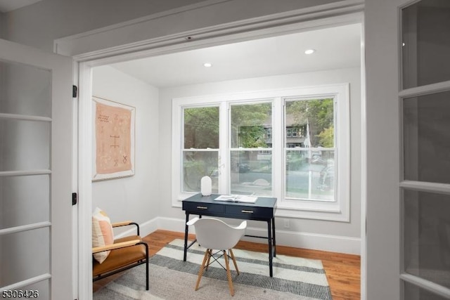 office space with light hardwood / wood-style flooring