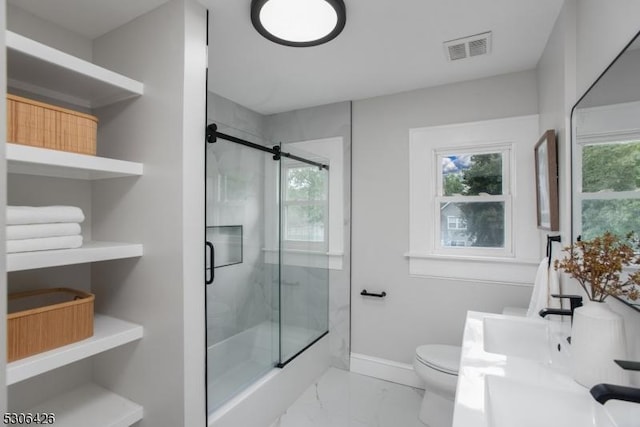 bathroom with vanity, toilet, and an enclosed shower