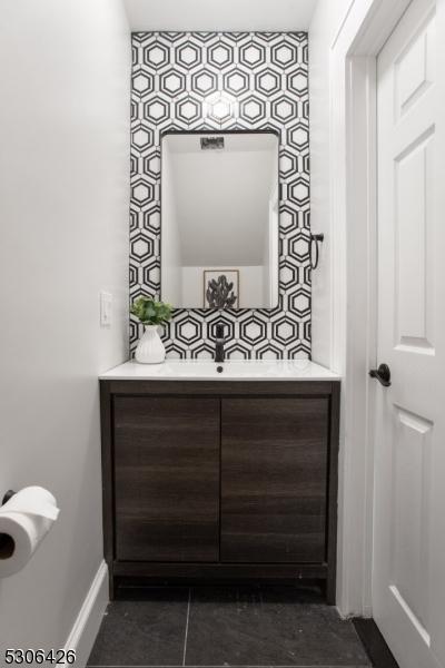 bathroom with vanity and tile patterned flooring