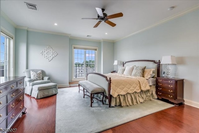 bedroom with ornamental molding, dark hardwood / wood-style floors, and ceiling fan