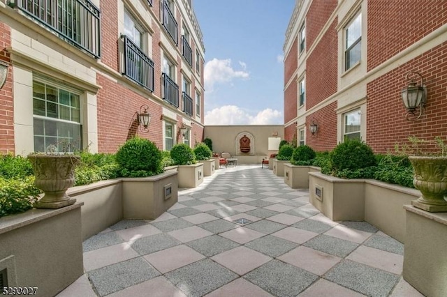 view of property's community featuring a patio area