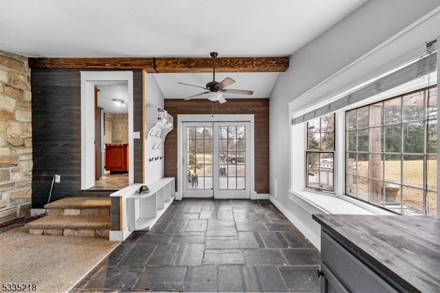 interior space featuring lofted ceiling with beams and ceiling fan