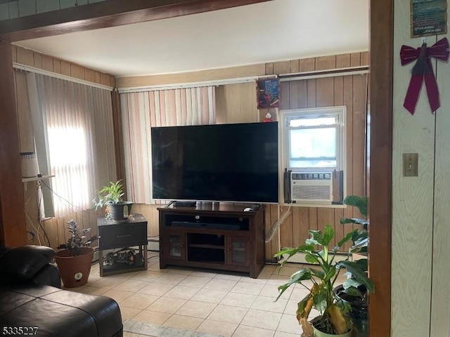 living room with cooling unit, light tile patterned floors, and wooden walls