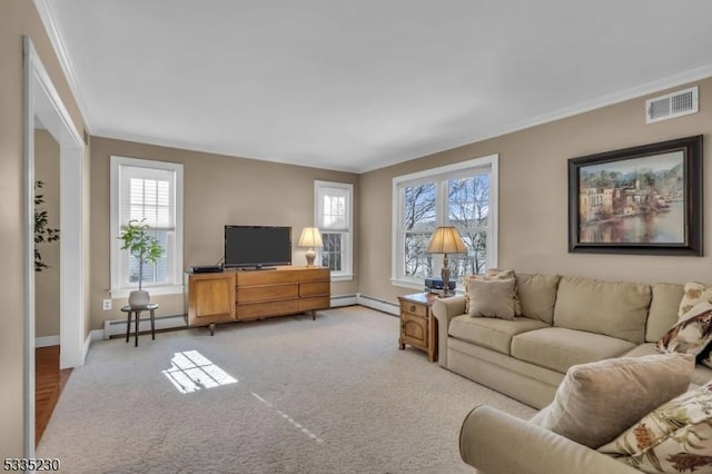 carpeted living room with crown molding and a healthy amount of sunlight