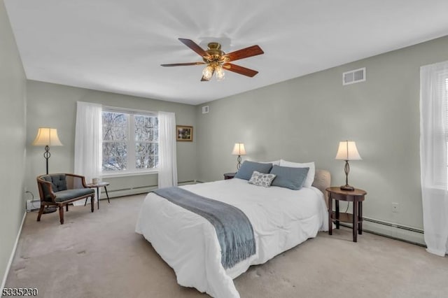 bedroom featuring ceiling fan, light colored carpet, and a baseboard heating unit