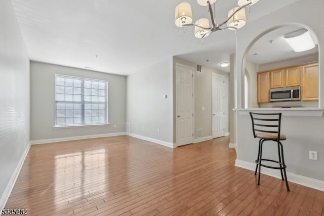 interior space with light hardwood / wood-style flooring and a chandelier